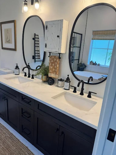 Nanaimo house cleaners disinfect and sanitize a bathroom until the mirror's, sinks, and countertops are spotless.