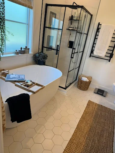 Professional cleaners in Nanaimo perfectly set up and tidy a client's bathroom.