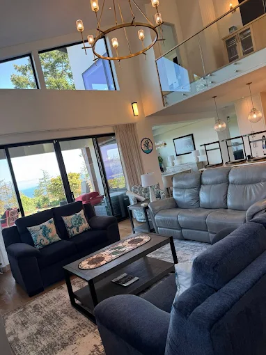 Nanaimo house cleaners do a tidy living room set up and deep clean using a Rainbow cleaning system.